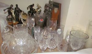 An oak three decanter tantalus together with drinking glasses,