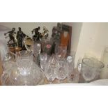 An oak three decanter tantalus together with drinking glasses,