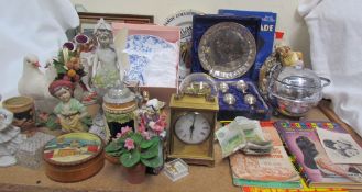 A pair of Staffordshire sheep spill vases together with an anniversary clock, another clock,