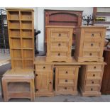 A modern pine desk together with three matching pine bedside chests of drawers,