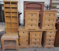 A modern pine desk together with three matching pine bedside chests of drawers,