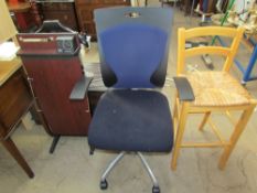 A trouser press together with an office chair and a bar stool