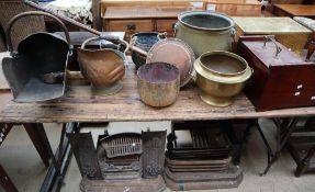 A brass log basket together with brass jardinières, copper coal scuttles, fire grates,