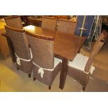 A modern refectory dining table on square legs together with a set of six caned dining chairs