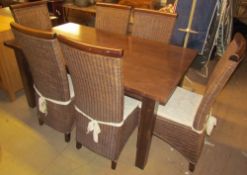 A modern refectory dining table on square legs together with a set of six caned dining chairs