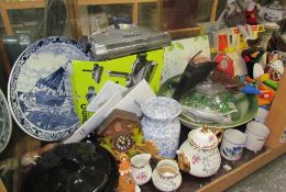 A large lot including a water basin, mugs, charger, toys, Coalport figures, mantle clock,