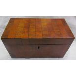 A 19th century mahogany tea caddy of rectangular form with two divisions to the interior