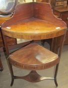 A George III mahogany corner washstand with cross banding and inlaid decoration having three tiers