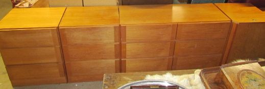 A teak effect chest of drawers together with a pair of smaller chests of drawers and a coffer type