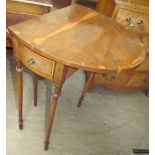 A 20th century yew wood Pembroke type occasional table of oval form with two cross-banded drop