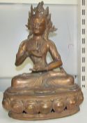 A large bronze figure of a seated buddhistic figure