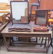 A 20th century oak console table together with two Victorian mahogany toilet mirrors