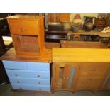 A modern light oak sideboard together with a painted pine chest of drawers and a pine bedside