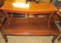 A Chinese carved hardwood coffee table of rectangular form,