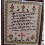 A 19th century woolwork sampler with a leaf border, trees beds,