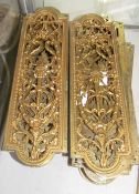 A collection of gilt metal pierced finger plates