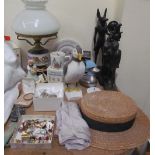 A table lamp with a hunting scene together with Egyptian figures, puffin figure, hat,