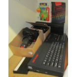 A Sinclair 128k ZX Spectrum +2 together with controllers etc