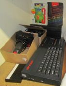 A Sinclair 128k ZX Spectrum +2 together with controllers etc