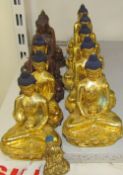 A collection of gilt bronze figures of seated buddhistic figures