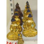 A collection of gilt bronze figures of seated buddhistic figures