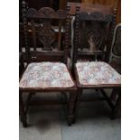 A pair of 19th century carved oak dining chairs