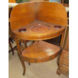 A George III mahogany corner washstand,