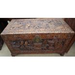 A Chinese carved camphor wood coffer decorated with figures