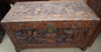 A Chinese carved camphor wood coffer decorated with figures