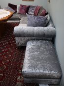 A silver and purple upholstered corner suite and matching foot stool