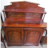 A Victorian mahogany chiffonier, with a raised back and shelf with ring turned columns,