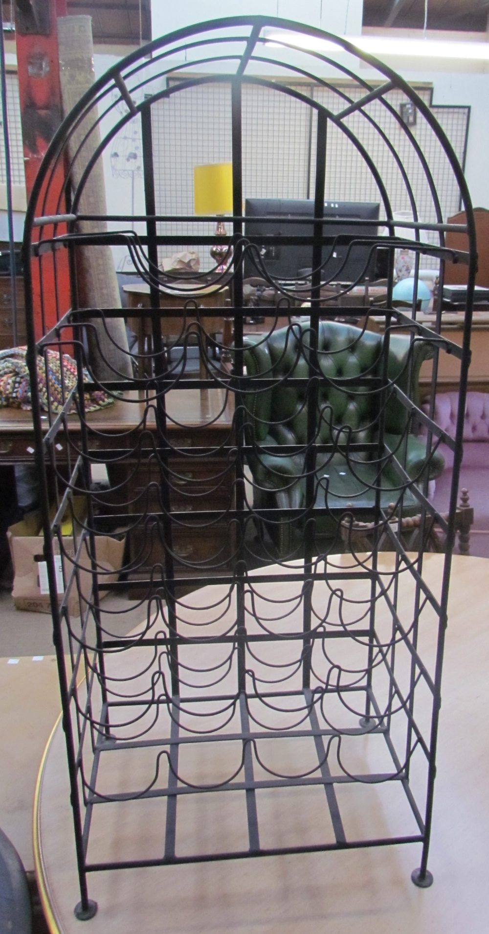 A wrought iron wine rack,