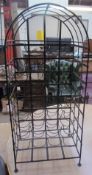 A wrought iron wine rack,