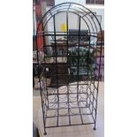 A wrought iron wine rack,