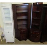 Two Beresford and Hicks reproduction mahogany standing corner cupboards together with a white wall