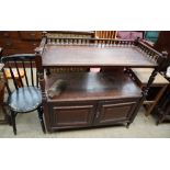 A mahogany buffet together with a black painted kitchen chair