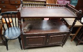 A mahogany buffet together with a black painted kitchen chair