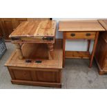 A pine side cabinet with a rectangular top above a frieze drawer on square legs together with a