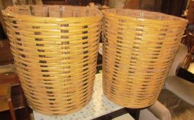 A pair of large wicker baskets