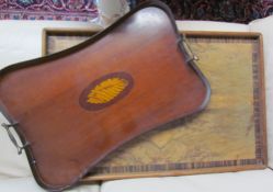 An Edwardian mahogany gallery tray with a pair of brass handles and central shell inlay together