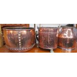 A large copper log basket with twin brass handles together with a coal bucket on brass lions paw