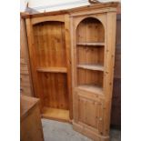 A modern pine standing corner cupboard together with a pine bookcase