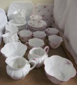 A Shelley Bridal Rose pattern part tea set together with another Shelley bone china part tea set