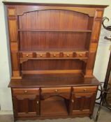 A 20th century mahogany dresser, the rack with shelves and drawers,