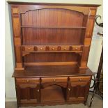 A 20th century mahogany dresser, the rack with shelves and drawers,