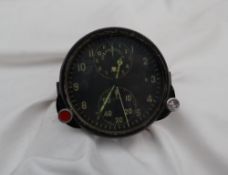 A Russian Aviators flight duration meter, the black dial with two subsidiary dials,