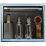 A George V silver, blue enamel and bakelite travelling dressing table set,