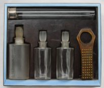 A George V silver, blue enamel and bakelite travelling dressing table set,