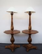 A pair of gilt decorated standard lamps / tables,