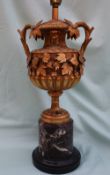 A late 19th century ormolu table lamp in the form of a two handled pedestal urn,